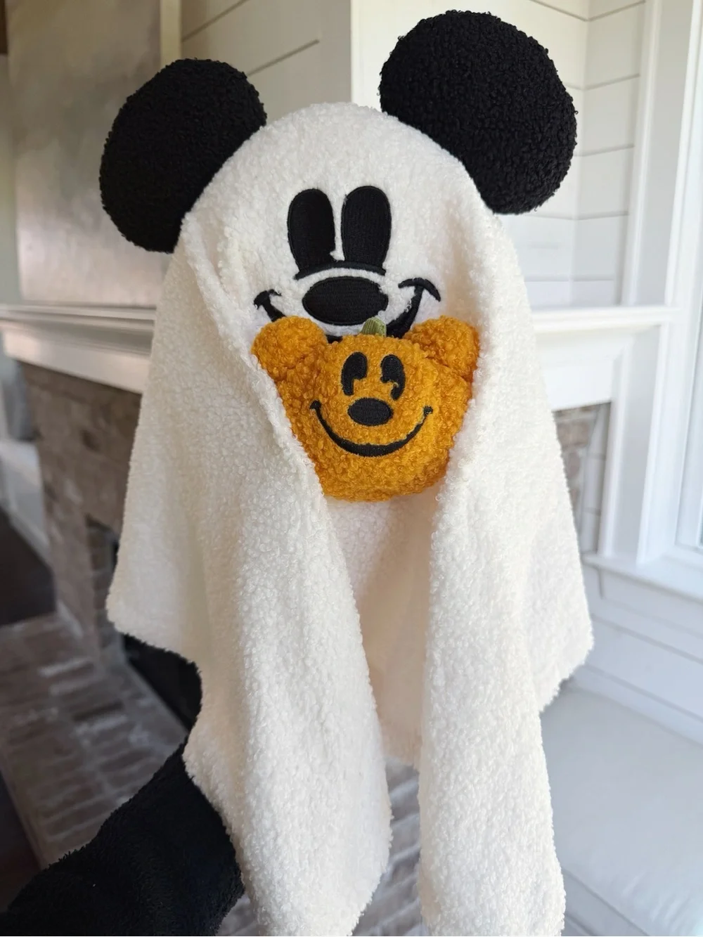 Mickey ghost holding Mickey pumpkin pillow